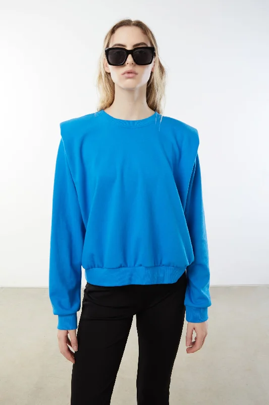 Women's zip - up sweatshirt in pastel blue for a soft and stylish outfit CREWNECK SWEATSHIRT WITH SHOULDER PADS Women's zip - up sweatshirt in pastel blue for a soft and stylish outfit CREWNECK SWEATSHIRT WITH SHOULDER PADS