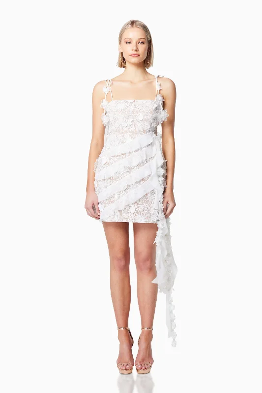 Printed Abstract Women Dress for a Modern and Artistic Appeal Printed Abstract Women Dress for a Modern and Artistic Appeal Isles 3D Rosette Mini Dress in White